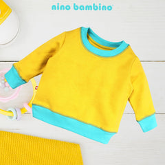 Stylish and Snug: Finding the Perfect Infant Winter Dress with Nino Bambino.